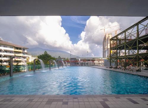 a large swimming pool in the middle of a building at Geo38 Genting 3Bed2Bath 10 pax High Floor Free WiFi in Genting Highlands