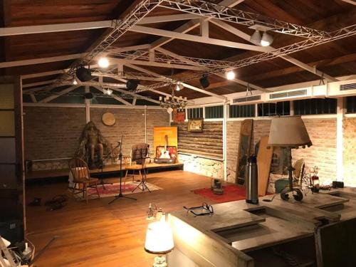 a large room with a table and chairs in it at Hermosa Casa Quinta in Ingeniero Maschwitz