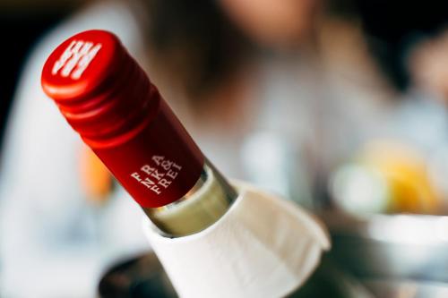 a close up of a red bottle of wine at business & conference Sporthotel Großwallstadt in Großwallstadt