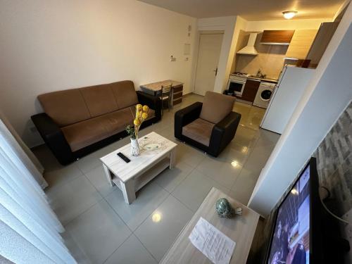 a living room with a couch and a coffee table at Kyrenia center, 2 bedroom, 1 living room, residential apartment in Kérynia