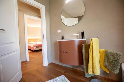 a bathroom with a sink and a mirror on the wall at La Noix - Alloggi ad uso turistico - VDA - ARVIER - n 0041 e n 0042 in Arvier
