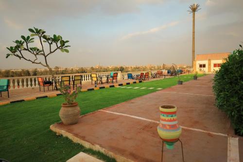a parking lot with tables and chairs and a park at Horus Mini Resort in Cairo