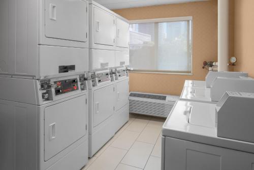 a kitchen with white appliances and a window at Residence Inn by Marriott San Diego Downtown in San Diego