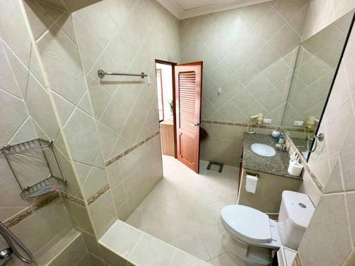 a bathroom with a toilet and a sink at View Talay Villas - Luxury 1BR pool villa nr beach - 171 in Jomtien Beach