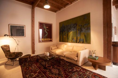 a living room with a couch and a table at Villa with Rooftop Terrace in Barranco in Lima