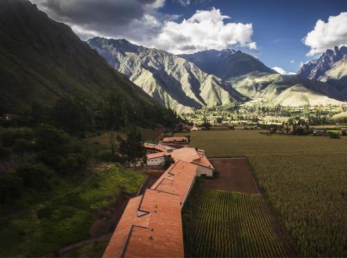an aerial view of a valley with mountains in the background at Explora Valle Sagrado in Urubamba