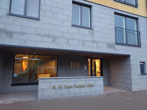 a store front of a building with a sign on it at New AC Studio City Center. in Turku