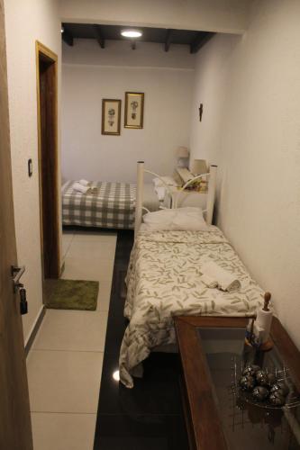 Apartamento 1 tesisinde bir odada yatak veya yataklar