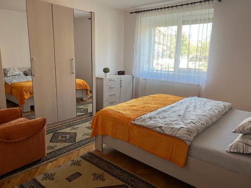 a bedroom with a bed and a mirror at Amma House Timisoara in Timişoara