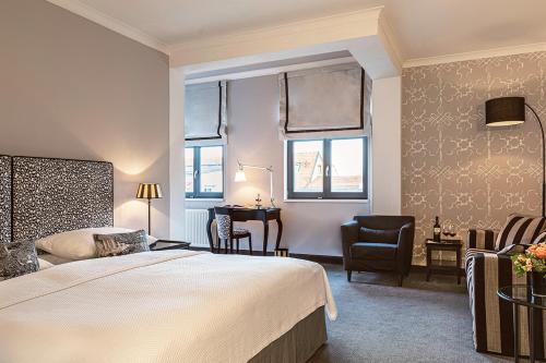 Un ou plusieurs lits dans un hébergement de l'établissement Hotel Goliath am Dom