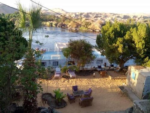 a view of a yard with chairs and a river at جزيره سهيل in Cairo