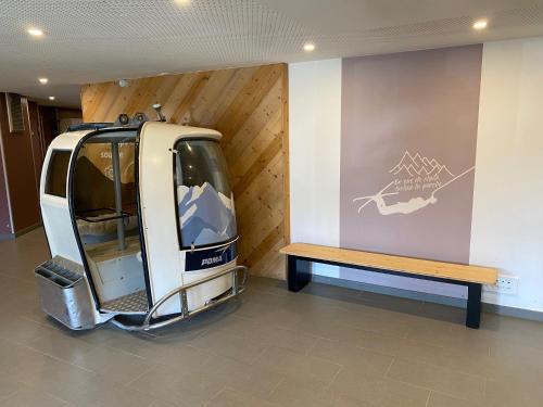 a parked van with a bench in a room at BILLY AVORIAZ - Résidence ARIETIS - Appartem. 8 pers - 2 chambres in Morzine