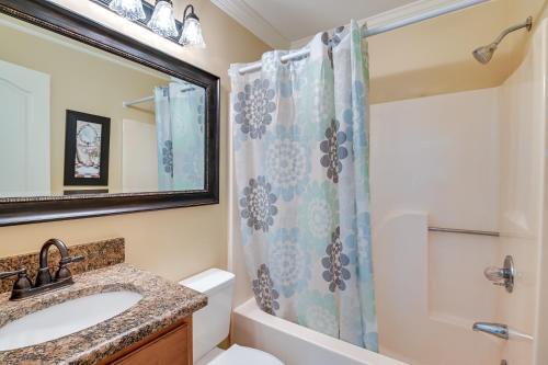 a bathroom with a sink and a shower at Beachfront Murrells Inlet Home - Walk to Pier! in Myrtle Beach