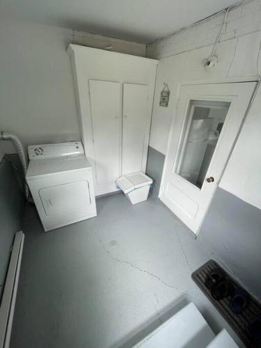 a small white bathroom with a sink and a toilet at 1740 Le Cocon Limoilou Hôpital Enfant-Jésus in Quebec City
