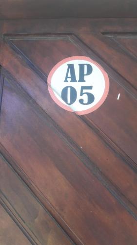 a wooden drawer with a ap sign on it at Pousada da Rotatória in São Gonçalo do Amarante