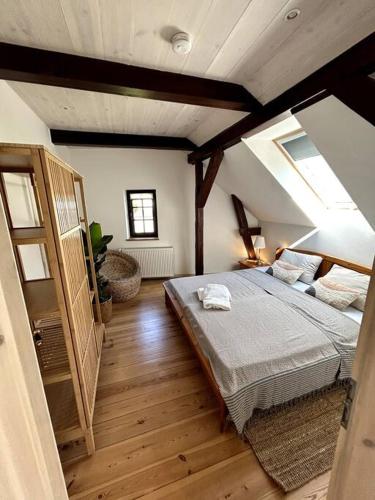 a bedroom with a large bed in a attic at Loft in Historischer Schmiede in Berlin