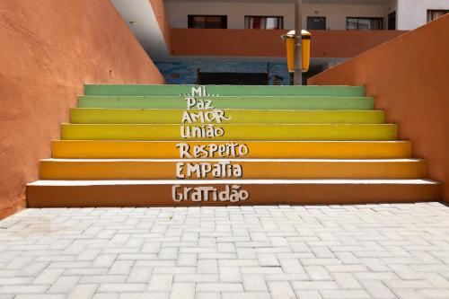a set of stairs with writing on them at 3 bdr cozy apt in Condominio Mi, Palmarejo Grande in Praia