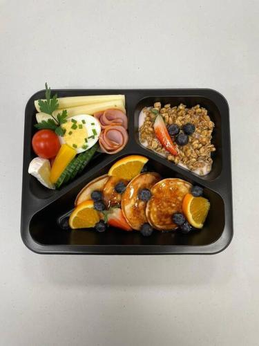 a black tray filled with different types of food at MountainBase - Widokowy 1 in Kościelisko
