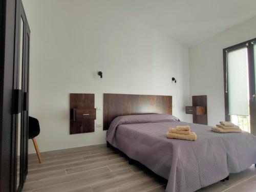 Postel nebo postele na pokoji v ubytování residence Sant'Anna i4MORI