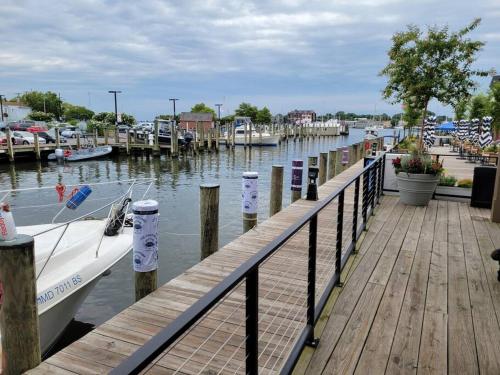 a boat is docked next to a dock at Annapolis @Gate 1 steps to the Harbor Free parking in Annapolis