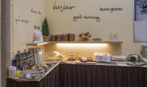 a buffet line with food on top of it at Apartment Hotel Konstanz in Konstanz