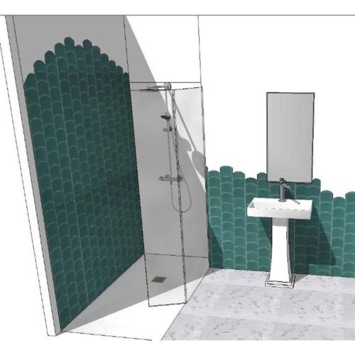 een badkamer met een douche en een wastafel bij Chic et cosy maison année 30 in Lorient
