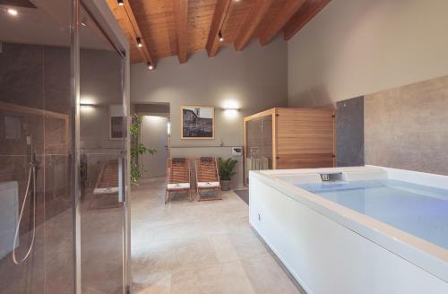a large bathroom with a tub and a shower at Agriturismo Querceto in Frazione Mocaiana