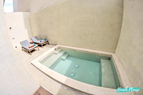 an overhead view of a bath tub in a room at Arenka - 2BR w Private Pool & Sunset Rooftop in Bucerías