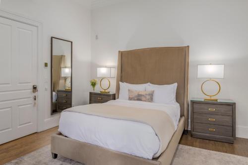a bedroom with a large bed with two night stands at The George in Napa