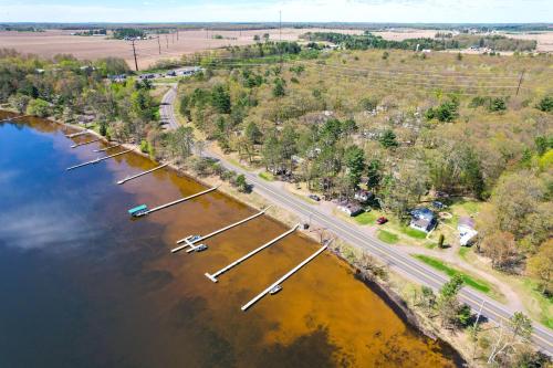 an aerial view of a river with boats in the water at Stone Lake Cabin with Private Deck and Fire Pit! in Northwoods Beach