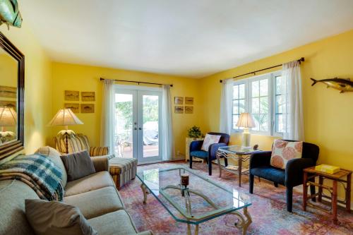 a living room with a couch and chairs and a table at West Palm Beach Home with Fenced-In Yard and Deck! in West Palm Beach