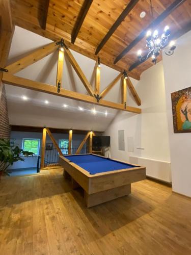 a large room with a pool table in it at Na Uboczu in Gryfów Śląski