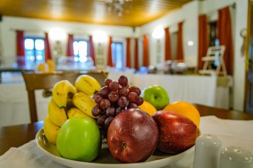 a bowl of fruit sitting on a table at Kipi Mountain Resort in Kipoi