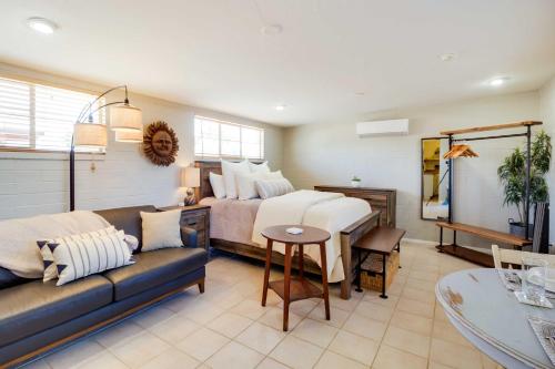 a living room with a bed and a couch at Adorable Tucson Studio with Gas Grill and WiFi! in Tucson