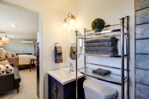 a bathroom with a sink and a towel rack at Adorable Tucson Studio with Gas Grill and WiFi! in Tucson