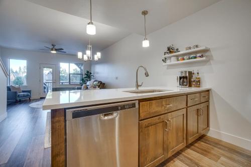 a kitchen with a sink and a dishwasher at McCall Vacation Rental with Private Balcony and Grill! in McCall