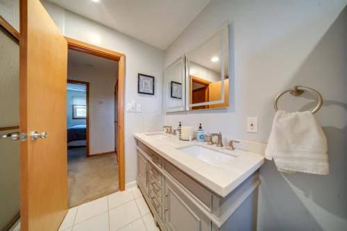 a bathroom with a sink and a mirror at Cozy Ripley Apartment - 21 Mi to Downtown Erie! in North East