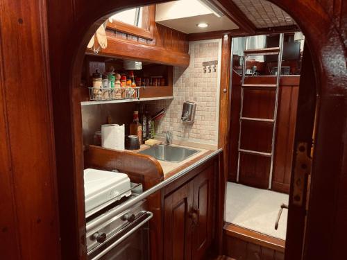 a small kitchen with a sink and a counter at Dreaming of Ithaca in Las Palmas de Gran Canaria