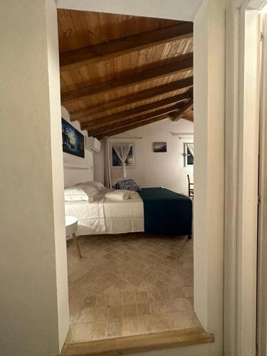 Ένα ή περισσότερα κρεβάτια σε δωμάτιο στο Residenza ammiraglio Filippo
