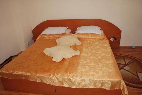 Postel nebo postele na pokoji v ubytování Casa Olanescu