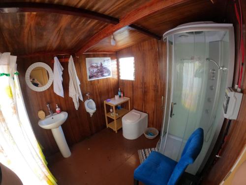 an overhead view of a bathroom with a toilet and a shower at Pachamama Titicaca Lodge in Puno
