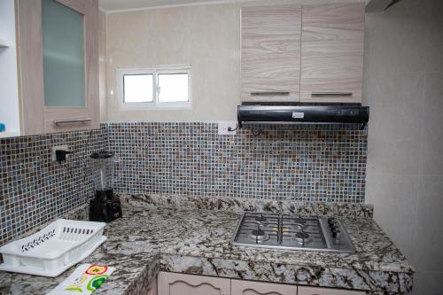 a kitchen with a counter top with a stove at CASA PETRA in Cartagena de Indias