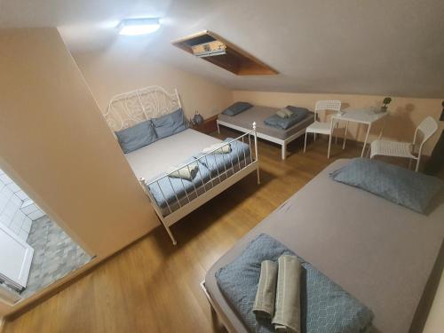 an overhead view of a bedroom with a bed and a table at HANCHO - KAPANA CENTER PLOVDIV in Plovdiv