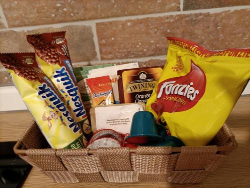 a basket of food and snacks on a table at Jeppson home in Terni