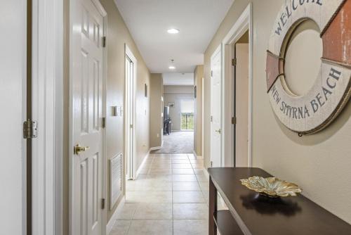 a hallway with a hallwayiterator at Estuary Views Close to Pool Amenities Walk to Beach 9-505 in New Smyrna Beach