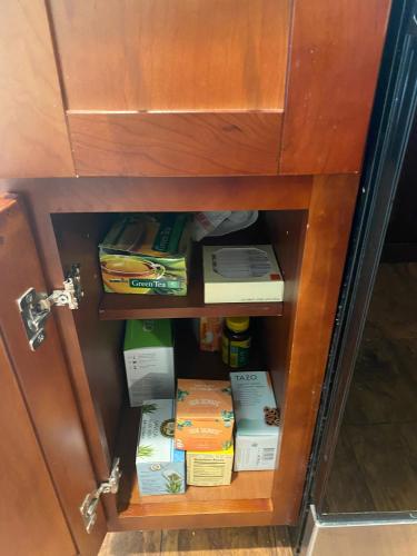 a cabinet with books inside of it at Work and Gym Hideaway in San Jose
