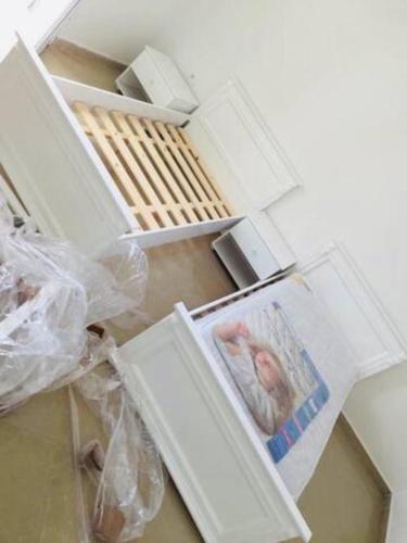 an open refrigerator door with a picture in it at un nouveau appartement avec un parking sur place in La Marsa