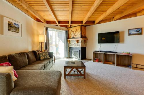 a living room with a couch and a fireplace at Mtn-View Condo with Community Perks in Silverthorne in Silverthorne