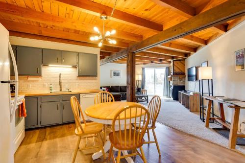 a kitchen and dining room with a table and chairs at Mtn-View Condo with Community Perks in Silverthorne in Silverthorne