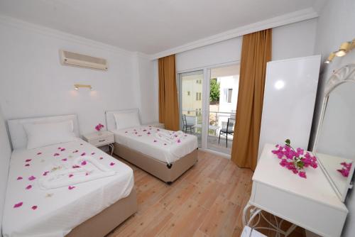 Ένα ή περισσότερα κρεβάτια σε δωμάτιο στο Neruda Hotel